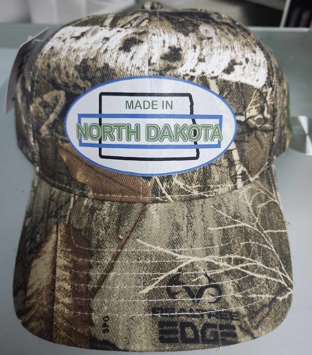Oval Version of Made in North Dakota on a Camouflage Cap - Image 2